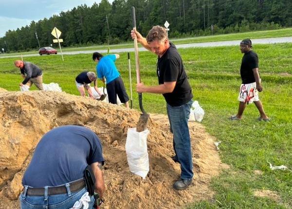 In anticipation of Tropical Storm Idalia's projected landfall as a hurricane, Alachua County residents fill sandbags at a makeshift public works station in Alachua, Fla., on Aug. 28, 2023. (Courtesy of Ray Holt)