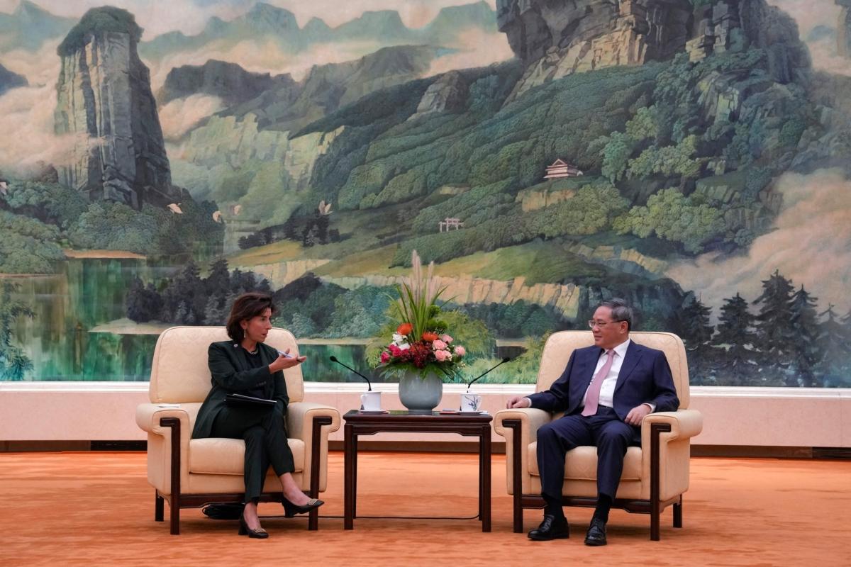 China's Premier Li Qiang (R) speaks with U.S. Commerce Secretary Gina Raimondo during their meeting in Beijing on Aug. 29, 2023. (Andy Wong/AFP via Getty Images)