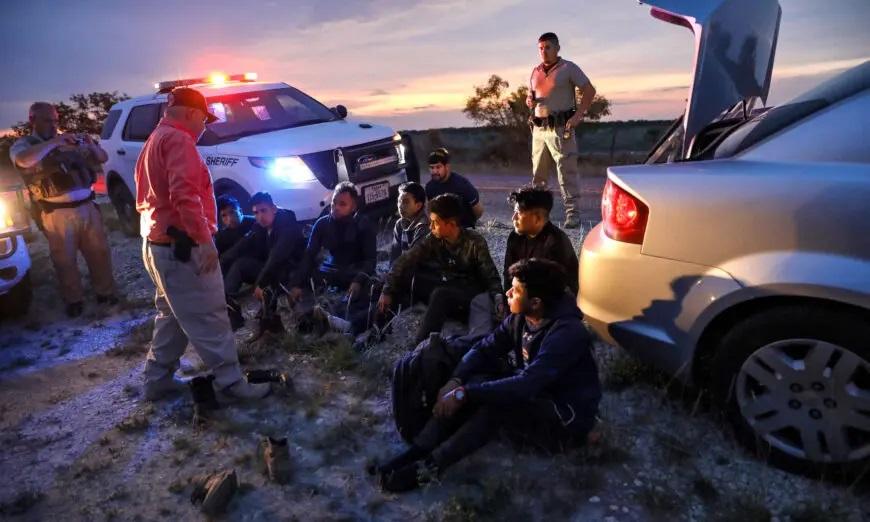 Kinney County Constable Steve Gallegos and Kinney County Sheriff’s deputies arrest a smuggler and seven illegal aliens from Guatemala near Brackettville, Texas, on May 25, 2021. (Charlotte Cuthbertson/The Epoch Times)