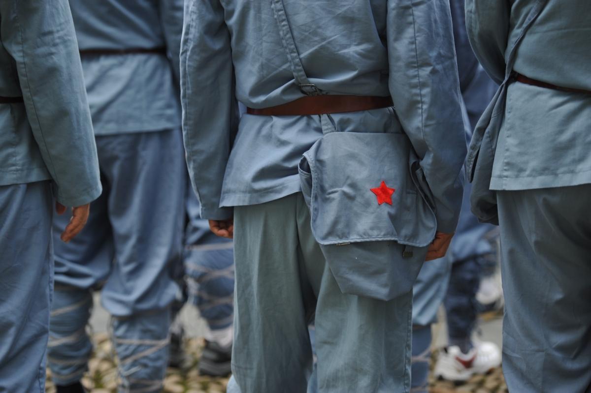 Visitors dressed in Red Army uniforms take part in a tour in Jinggangshan in central China, on Sept. 21, 2012. (Peter Parks/AFP/Getty Images)