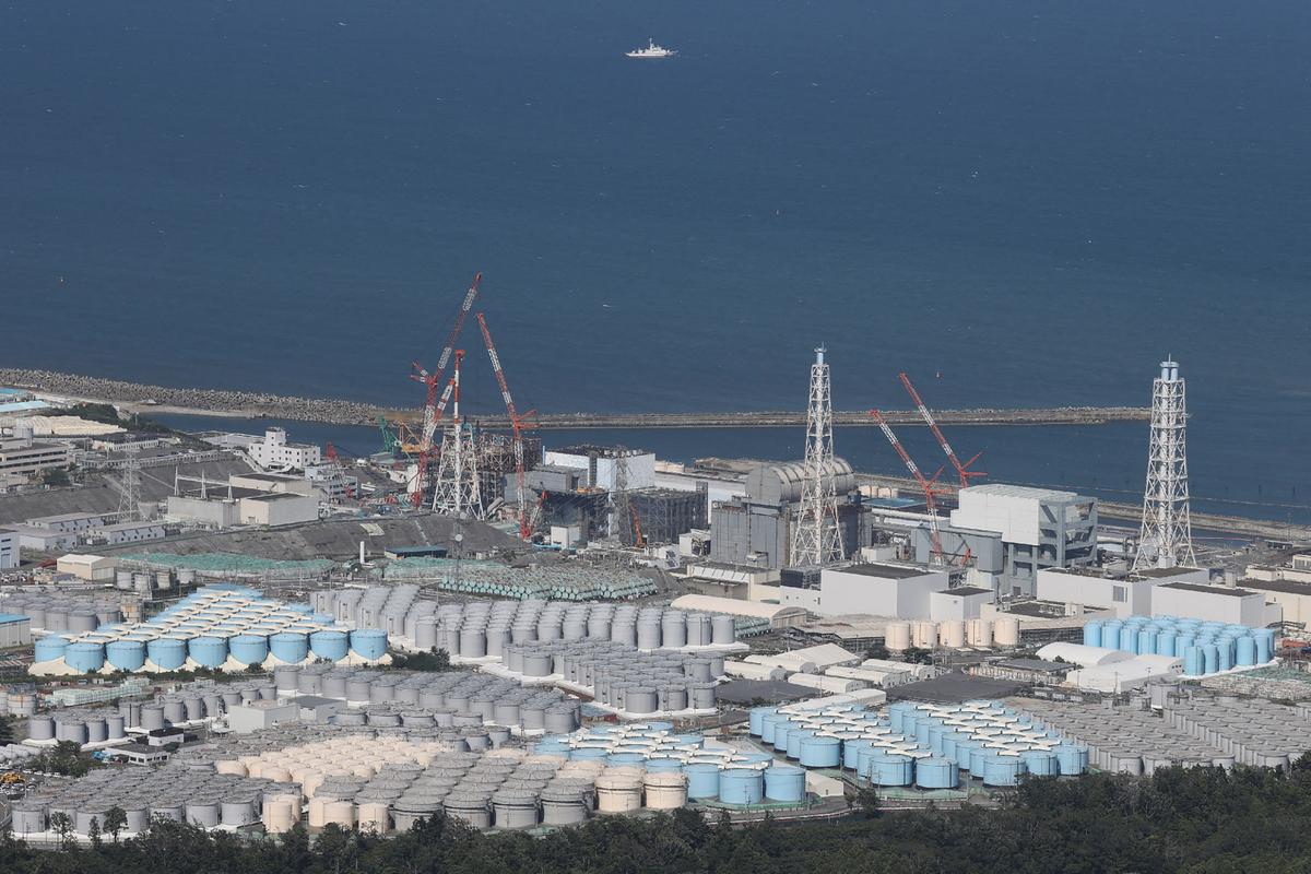 This aerial picture shows storage tanks used for storing treated water at TEPCO's crippled Fukushima Daiichi Nuclear Power Plant in Okuma, Fukushima prefecture, on Aug. 24, 2023. (STR/JIJI Press/AFP via Getty Images)