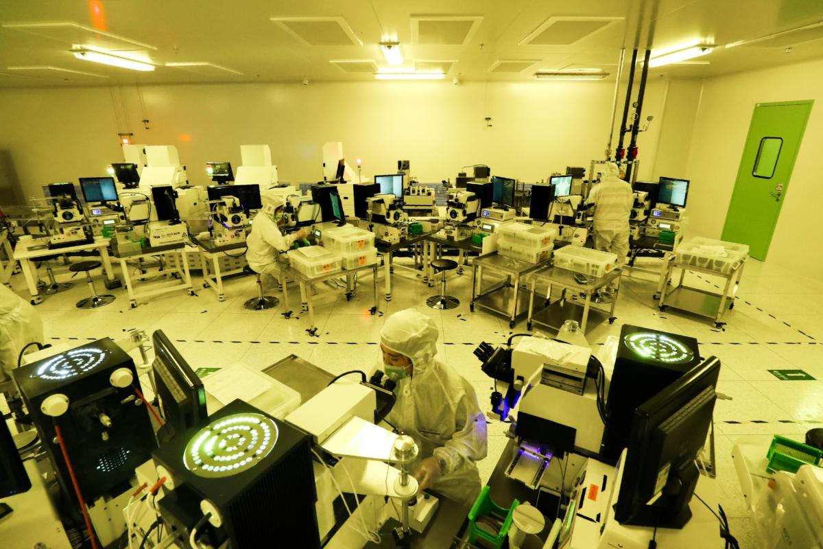 Employees make chips at a factory of Jiejie Semiconductor Co. in Nantong, Jiangsu Province, China, on March 17, 2021. (STR/AFP via Getty Images)