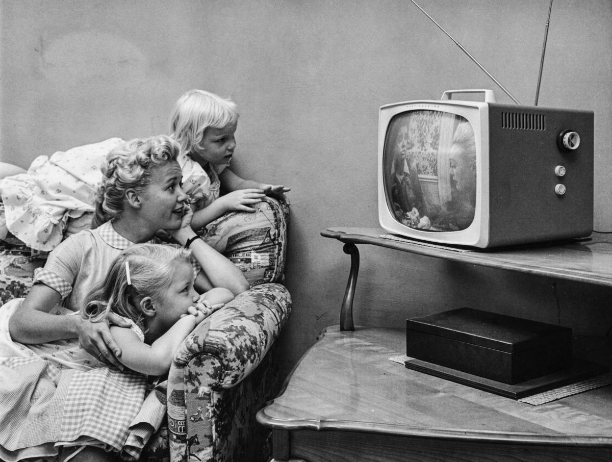 A family watches television in their home in 1955. (Archive Photos/Getty Images)