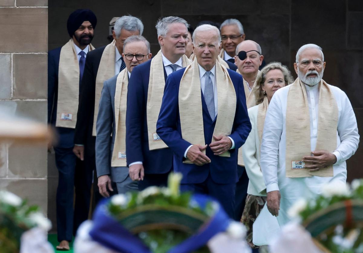 India's Prime Minister Narendra Modi (R), U.S. President Joe Biden (C), German Chancellor Olaf Scholz (3R) and Australia's Prime Minister Anthony Albanese (3L) along with world leaders arrive to pay respect at the Mahatma Gandhi memorial at Raj Ghat on the sidelines of the G20 summit in New Delhi on Sept. 10, 2023. (Ludovic Marin/POOL/AFP via Getty Images)