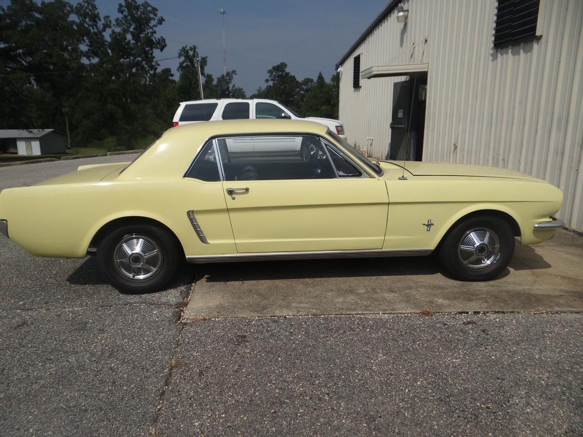 Mr. Fischer's personal classic yellow 1964 1/2 Mustang, which he occasionally brings to class. (Randy Tatano)