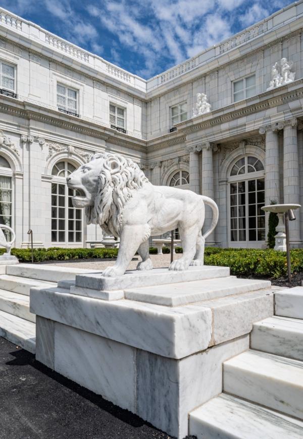 Guarding the main entrance or “cour d'honneur” of Rosecliff are two marble lion statues, so lifelike that details such as fur, claws, and even ribs are evident. The two lions sit atop a layered pedestal made of marble and are framed by the home’s numerous arched windows and columns. (David Hansen/Courtesy of The Preservation Society of Newport County)