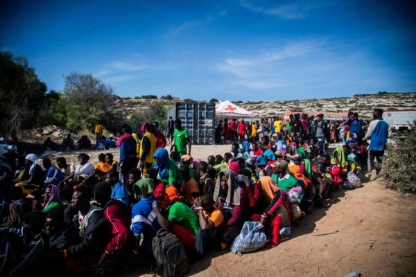 Illegal immigrants gather outside the operational centre called "Hotspot" on the Italian island of Lampedusa on Sept. 14, 2023. (Alessandro Serrano/AFP via Getty Images)