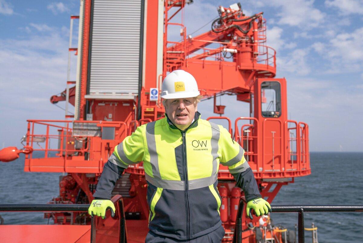 Prime Minister Boris Johnson onboard the Esvagt Alba during a visit to the Moray Offshore Wind Farm East, off the Aberdeenshire coast, during his visit to Scotland on Aug. 5, 2021. (Jane Barlow - WPA Pool/Getty Images)