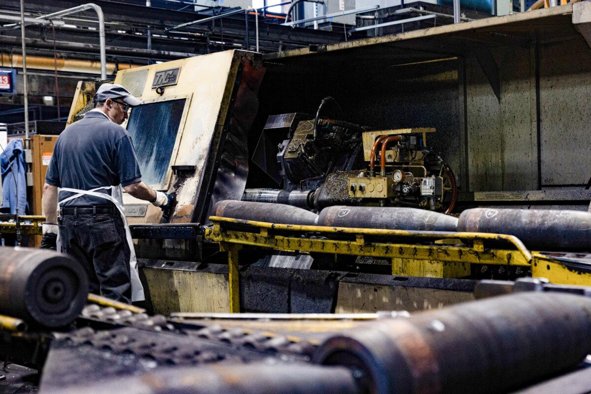 A worker checks the production of 155mm artillery shells at the Scranton Army Ammunition Plant in Scranton, Penn., on April 12, 2023. The United States, among numerous NATO nations, is now facing 155mm ammunitions shortages as the country continues to supply them to Ukraine. (Hannah Beier/Getty Images)