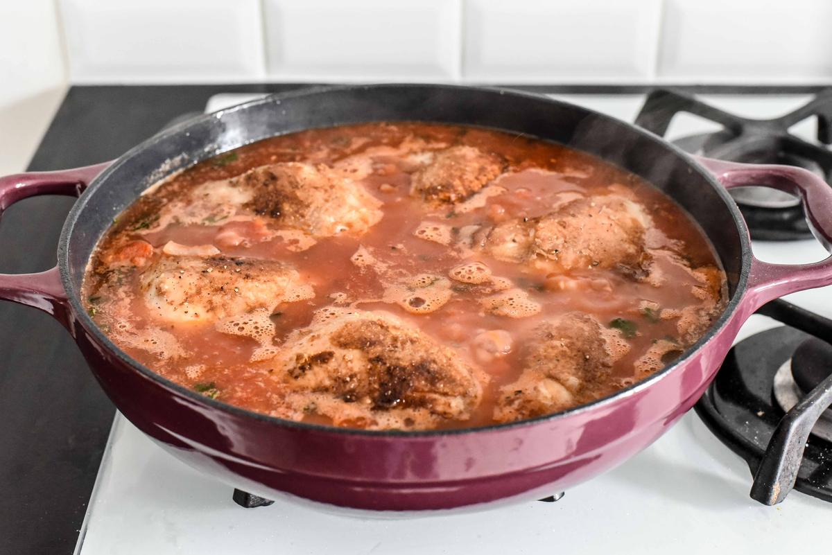The chicken then simmers until fork-tender and infused with flavor. (Audrey Le Goff)