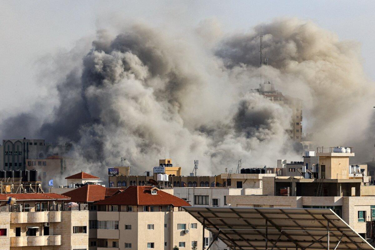 Smoke plumes rise over Gaza City during Israeli air strikes launched in retaliation for attacks on Israel, on Oct. 7, 2023. (Mahmud Hams/AFP via Getty Images)
