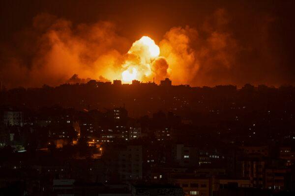Israel at War After Unprecedented Hamas Attack: What to Know | USNN World News Fire and smoke rise following an Israeli airstrike in Gaza City, on Oct. 8, 2023. (Fatima Shbair/AP Photo)