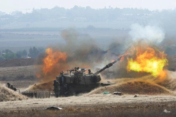 An Israeli mobile artillery unit fired a shell from southern Israel toward the Gaza Strip, in a position near the Israel-Gaza border, in Israel on Oct. 11, 2023. (AP Photo/Erik Marmor)