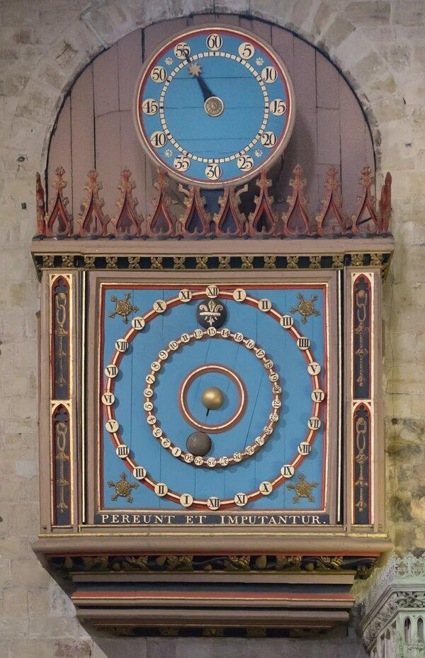 Dating from 1484, Exeter’s astronomical clock is a working model based on the solar system as it was understood at the time. The earth is in the center, represented by a fixed golden ball, with the moon and sun rotating around it. In the outer circle, a clock hand indicates the day in the lunar month and the hour of the day, as represented by the ball inside the lunar circle and the black fleur-de-lys disk representing the sun. The text below the main dial translates as “The hours pass and are reckoned to our account.” It is said that this clock is the source of the reputed English nursery rhyme “Hickory Dickory Dock.” (DeFacto/CC BY-SA 4.0)