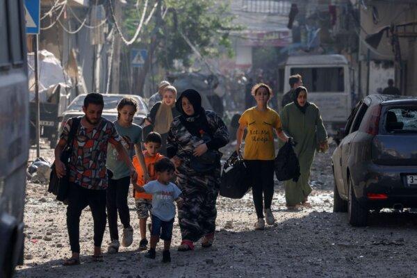 Palestinians evacuate a neighborhood in Gaza City on Oct. 11, 2023. (Mohammed Abed/AFP via Getty Images)