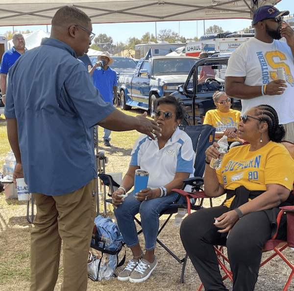 Louisiana Democrat gubernatorial candidate Shawn Wilson speaks with voters tailgating before Southern University’s Oct. 14 homecoming football game in Baton Rouge, La. — the Jaguars won but Mr. Wilson failed to notch a one-on-one Nov. 18 runoff against Republican state Attorney General Jeff Landry in Louisiana’s “jungle primary.” (Shawn Wilson For Governor)