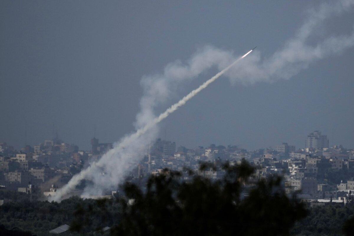 Rockets are fired toward Israel from the Gaza Strip, as seen from southern Israel, on Oct. 16, 2023. (Leo Correa/AP)
