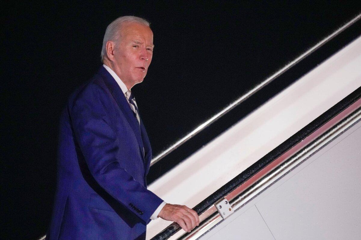 President Joe Biden answers questions as he boards Air Force One at Andrews Air Force Base, Md., to travel to Rehoboth Beach, Del., on Oct. 20, 2023. (Andrew Harnik/AP)