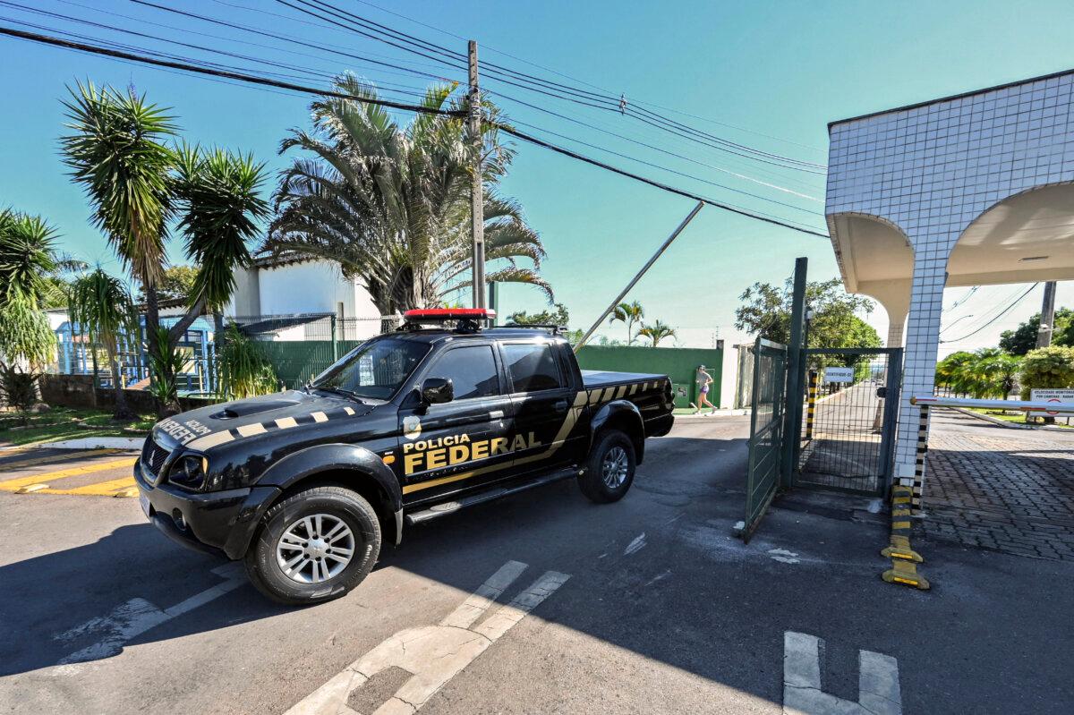A vehicle of the Federal Police leaves the condominium where Brazilian ex-president Jair Bolsonaro lives, after allegedly searching his home as part of an investigation into allegations of falsifying COVID-19 vaccination certificates, in Brasilia, Brazil, on May 3, 2023. (Evaristo Sa/AFP via Getty Images)