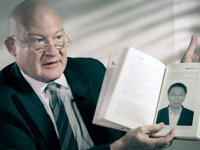 Ethan Gutmann holds a copy of his book "The Slaughter." (Courtesy of subject)