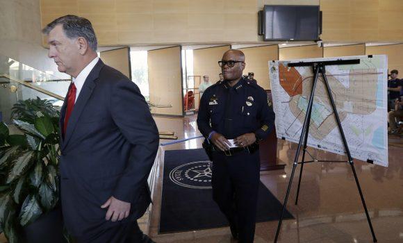 Dallas mayor Mike Rawlings, left, and Dallas police chief David Brown, right, leave a news conference, July 8, 2016, in Dallas. (AP Photo/Eric Gay)