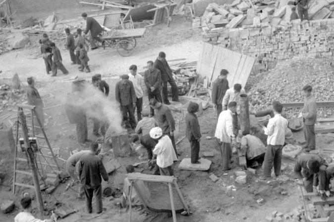 Employees of the Shin Chiao Hotel in Beijing build in the hotel courtyard (background) a small and rudimentary smelting steel furnace during the period of the "Great Leap Forward " in October 1958. (JACQUET-FRANCILLON/AFP/Getty Images)