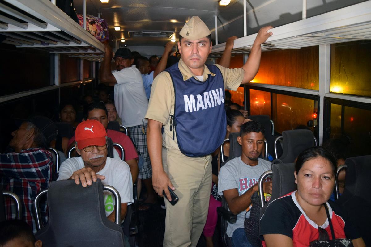 People are seen in a bus as they are being evacuated from their coastal town after an earthquake struck off the southern coast, in Puerto Madero, Mexico on Sept. 8, 2017. (REUTERS/Jose Torres )
