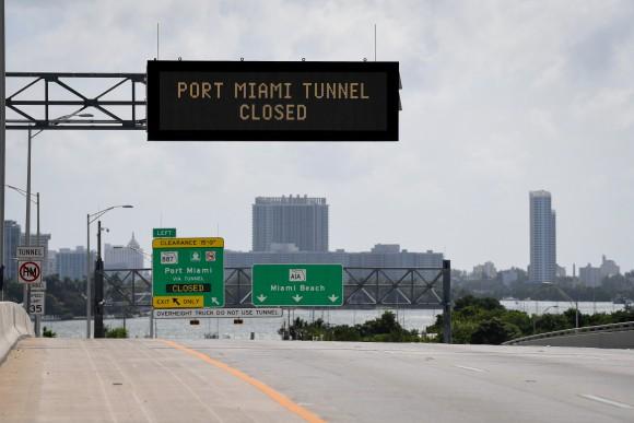 Signs warning of road closures are seen above the road in Miami Beach, Florida, U.S., September 8, 2017. (Reuters/Bryan Woolston)