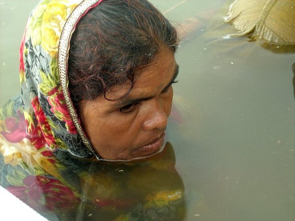 A woman sits in the water in central India as part of a protest against an increase in dam water levels. After 17 days of sitting in the cold water, the government gave in to protester demands. (Courtesy of Narmada Bachao Andolan)