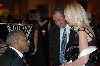 Guests greet Hon. Lincoln Alexander, former lieutenant governor of Ontario, at Ball Pologne on Saturday. (Madalina Hubert/The Epoch Times)