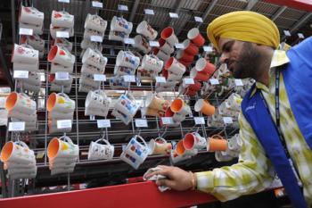 WAL-MART WORKERS: An employee cleans a section of cups in India's first Wal-Mart store, which opened in 2009. Wal-Mart stores are found all over the world, but not in New York City. City Council worries that if Wal-Mart opens a store in the city, the created jobs will be of poor quality. (Narinder Nanu/Getty Images ) WAL-MART WORKERS: An employee cleans a section of cups in India's first Wal-Mart store, which opened in 2009. Wal-Mart stores are found all over the world, but not in New York City. City Council worries that if Wal-Mart opens a store in the city, the created jobs will be of poor quality. (Narinder Nanu/Getty Images )
