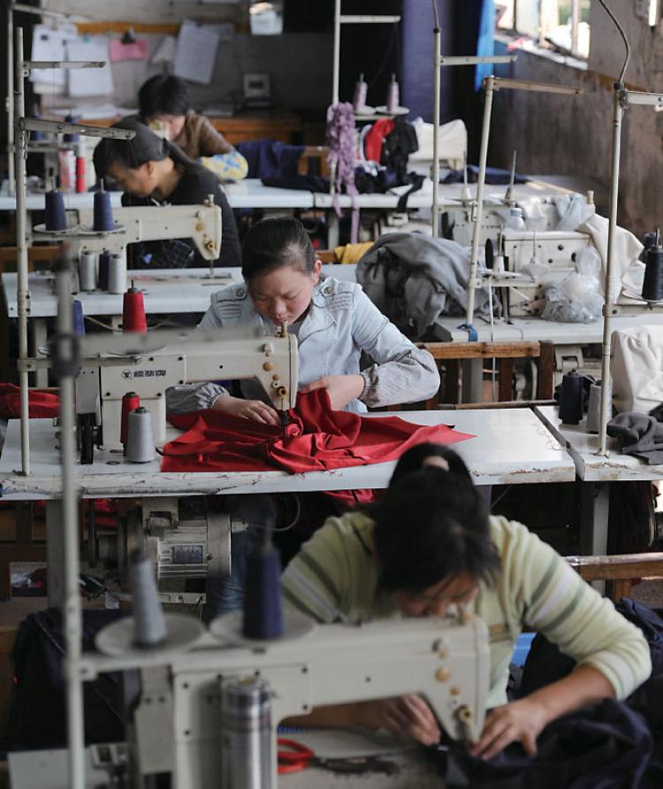 Women in China working for a Taiwanese Company. Taiwanese businesses in China have been hit hard by labor shortages and rising labor costs.  (AFP/Getty Images)