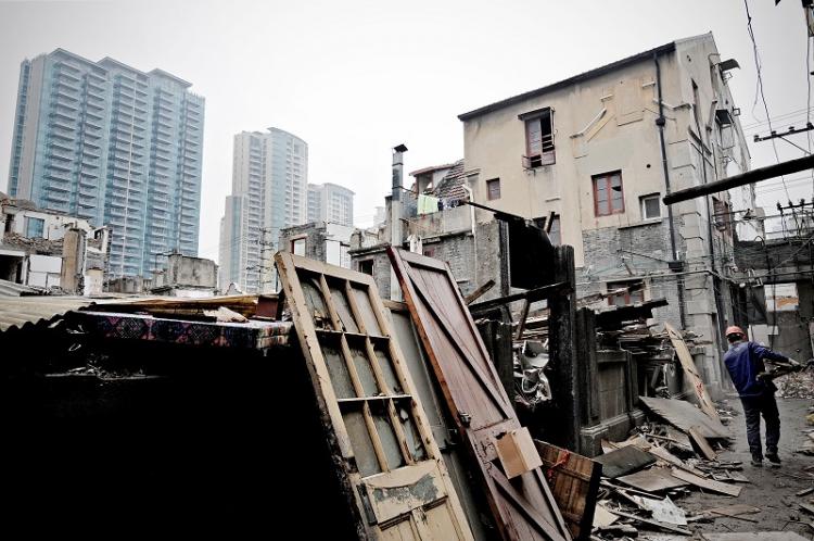 A property in Shanghai is being demolished to make way for new apartments.In 2009, the real estate market in China reached a state of frenzy with property prices rising tremendously (Getty)