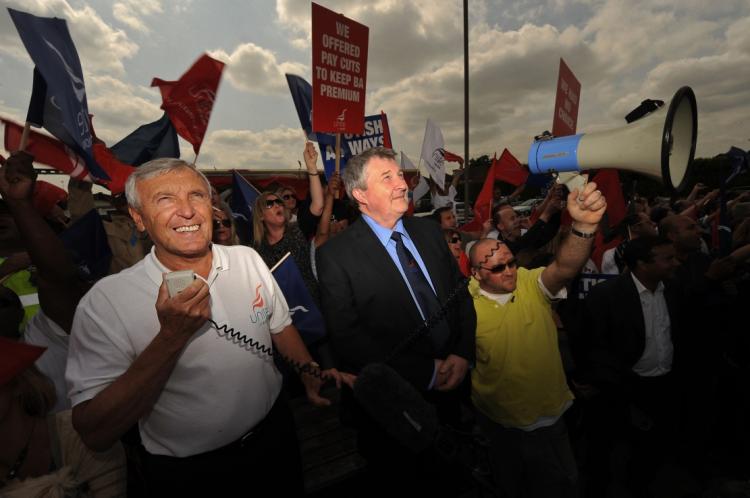 Joint general secretaries of the Unite union, Tony Woodley (L) and Derek Simpson (C) address striking British Airways cabin crew on the third day of a five-day strike near Heathrow Airport, in west London on May 26, 2010. (Ben Stansall/AFP/Getty Images)
