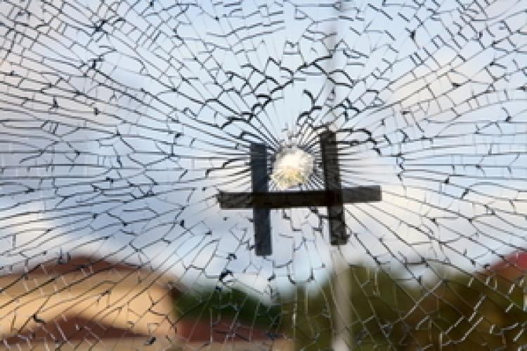 At approximately 3 p.m., Thursday Oct. 28, a shot pierced a hole in the large front window, splintering the glass. (Shan Ju Lin/The Epoch Times)