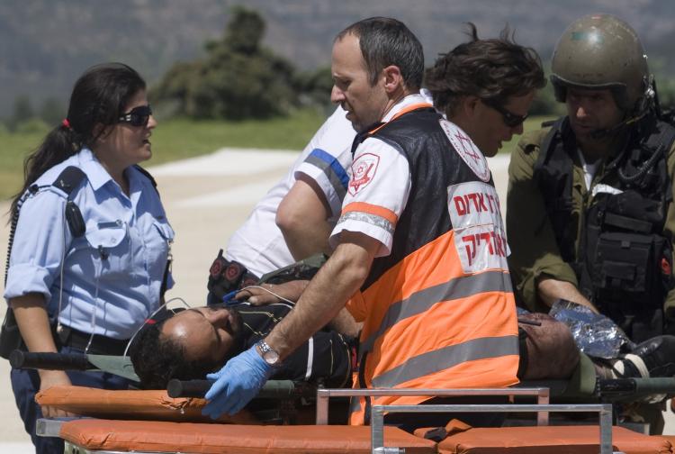A pro-Palestinian activist is evacuated to Hadassah Ein Kerem Hospital in Jerusalem after Israeli navy seals stormed a boat carrying humanitarian aid to the Gaza Strip against an Israeli blockade. (Ahad Gharabli/AFP/Getty Images)