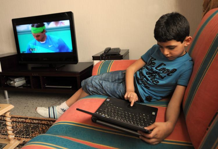 Kids exposed to the marketing of unhealthy foods through television, the Internet, and print ads are more likely to develop cardiovascular diseases, cancers, and diabetes later in life, says the World Health Organization. (Fethi Belaid/AFP/Getty Images)