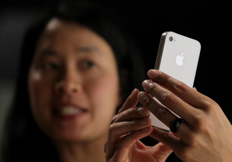 An Apple employee demonstrates the new iPhone 4 at the 2010 Apple World Wide Developers conference June 7, 2010 in San Francisco, California. Apple CEO Steve Jobs kicked off their annual WWDC with the announcement of the new iPhone 4.  (Justin Sullivan/Getty Images)