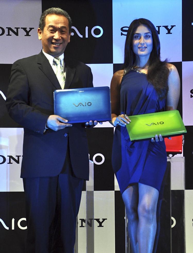Indian Bollywood actress Kareena Kapoor (R) and Sony India's managing director Masaru Tamagawa pose during the unveiling of the Vaio E Series 'Go Vivid' laptops in Mumbai on June 8. (STR/AFP/Getty Images)