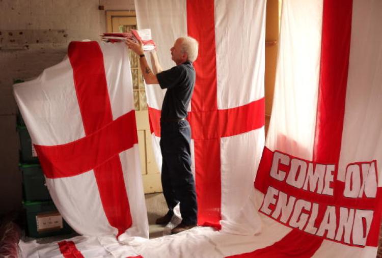 Piggotts' employee Bob McWilliam checks stock of the Flag of St George in the warehouse of the flag maker on June 8, 2010 in Ongar, England. (Peter Macdiarmid/Getty Images)