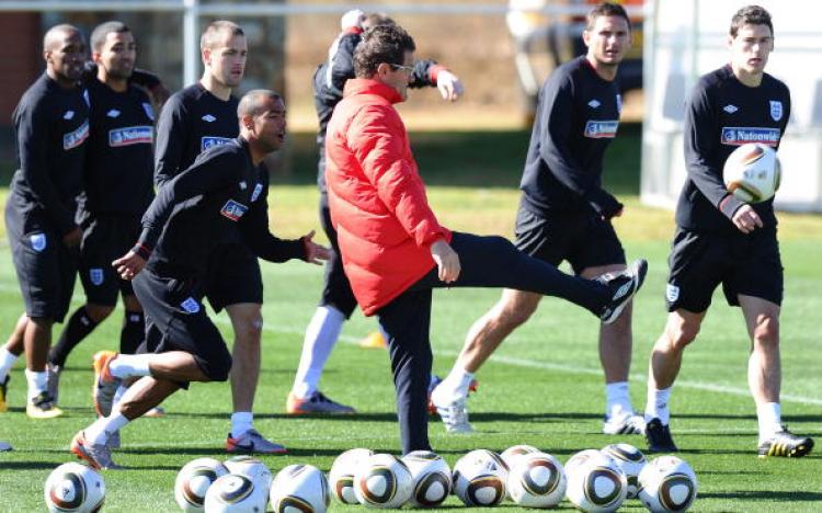 England's coach, Italian Fabio Capello, kicks off a game of football during a training session at the Royal Bafokeng Sports Campus near Rustenburg on 15 June, 2010 during the 2010 World Cup in South Africa.  (Paul Ellis/AFP/Getty Images )