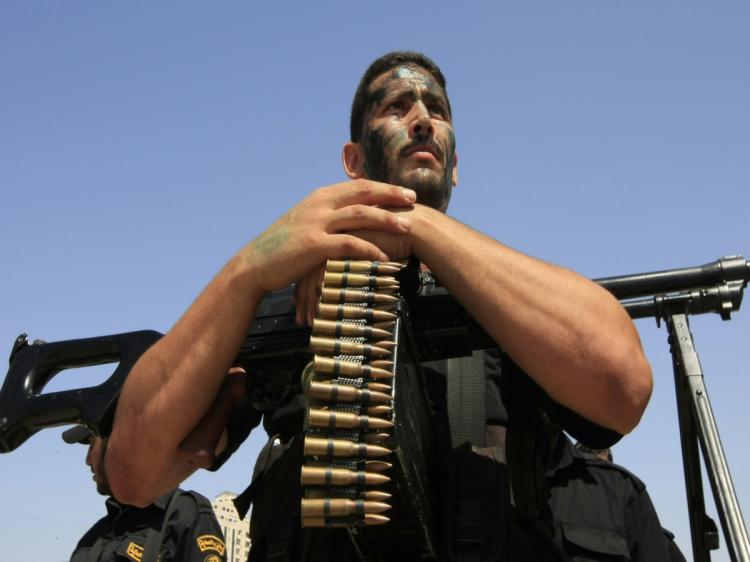 Members of Hamas' security forces demonstrate their skills during a graduation ceremony in Gaza City on June 17, 2010. The Islamic Resistance Movement, known as Hamas, won Palestinian legislative elections in 2006 and violently seized power in Gaza the following year. (Mohammed Abed/AFP/Getty Images)