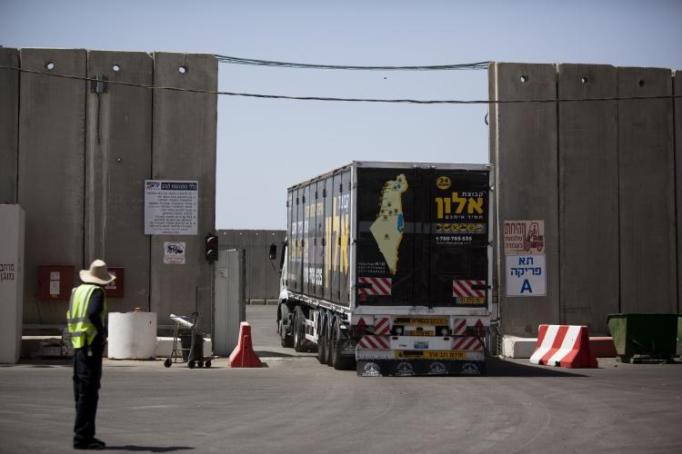 A truck arrives with goods for the Gaza Strip on the border between Gaza and Israel on June 21. On Sunday, Israeli Prime Minister Netanyahu announced details on the easing of restrictions on Gaza. Under the new regulations more goods will be allowed to enter Gaza.  (Uriel Sinai/Getty Images)