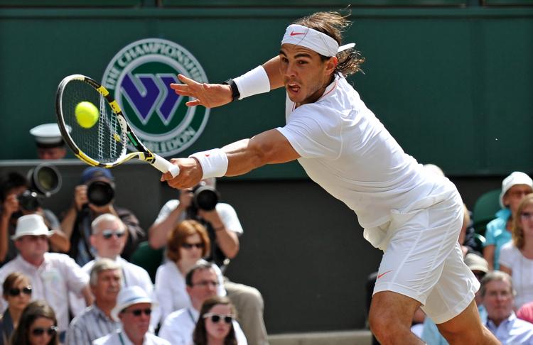 Rafael Nadal reaches to return one of Tomas Berdych's powerful serves during the Wimbledon final on Sunday. Nadal won his second Wimbledon title. (Adrian Dennis/AFP/Getty Images) Rafael Nadal reaches to return one of Tomas Berdych's powerful serves during the Wimbledon final on Sunday. Nadal won his second Wimbledon title. (Adrian Dennis/AFP/Getty Images)