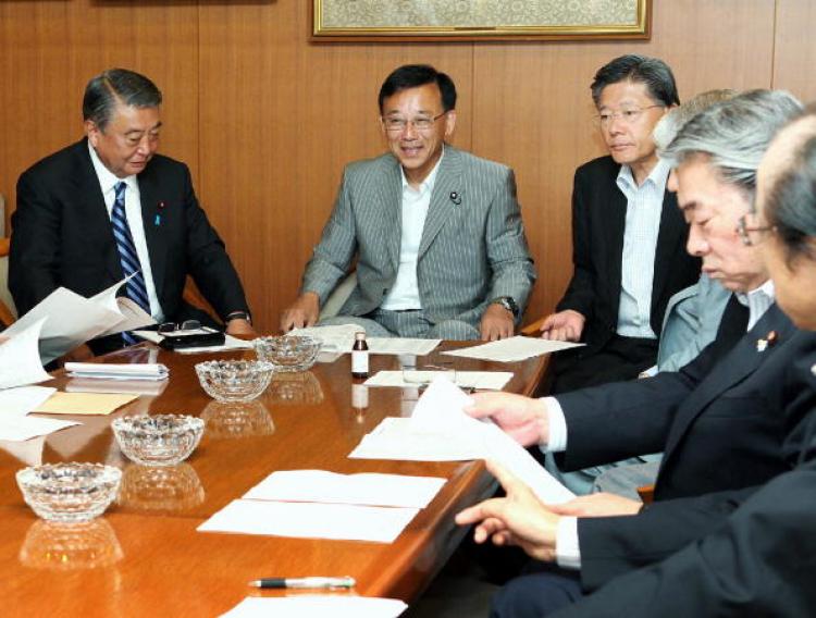 Japan's main opposition party, Liberal Democratic Party (LDP) leader Sadakazu Tanigaki (C) and party executives attend a meeting at the LDP headquarters in Tokyo on July 12, one day after of the Upper House election. (Jiji Press/Getty Images )