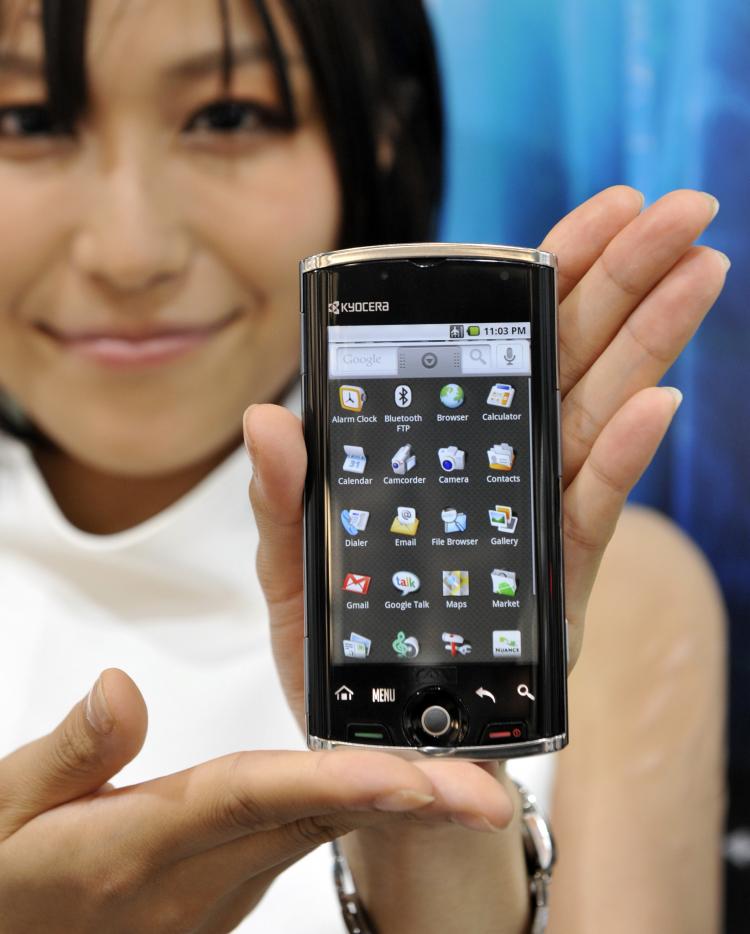 Japan's electronics giant Kyocera employee displays the new smart phone 'Zio M6000' based on Google's Android OS. The Android platform has become the largest smartphone platform in the U.S. and third-largest worldwide for Q2 2010. (Yoshikazu Tsuno/AFP/Getty Images)