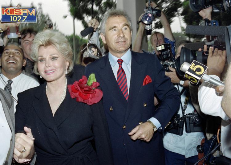 Zsa Zsa Gabor, flanked by her husband, Prince Frederick von Anhalt, Germany's duke of Saxony, enters Beverly Hills Municipal Court on Sept. 11, 1989. Gabor left the hospital for her Bel Air mansion on Saturday following a leg amputation. (Wade Byars/AFP/Getty Images)