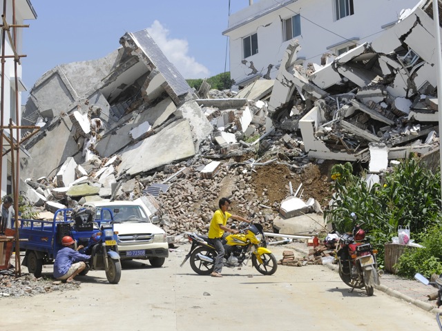 buildings destroyed by a flood-triggered landslide