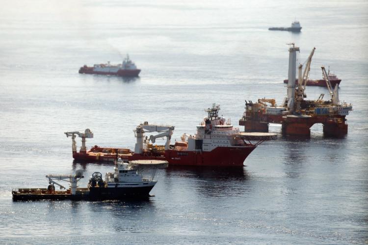 Ships work near the site of the BP Deepwater Horizon oil spill on August 3, 2010 in the Gulf of Mexico off the coast of Louisiana. (Chris Graythen/Getty Images)