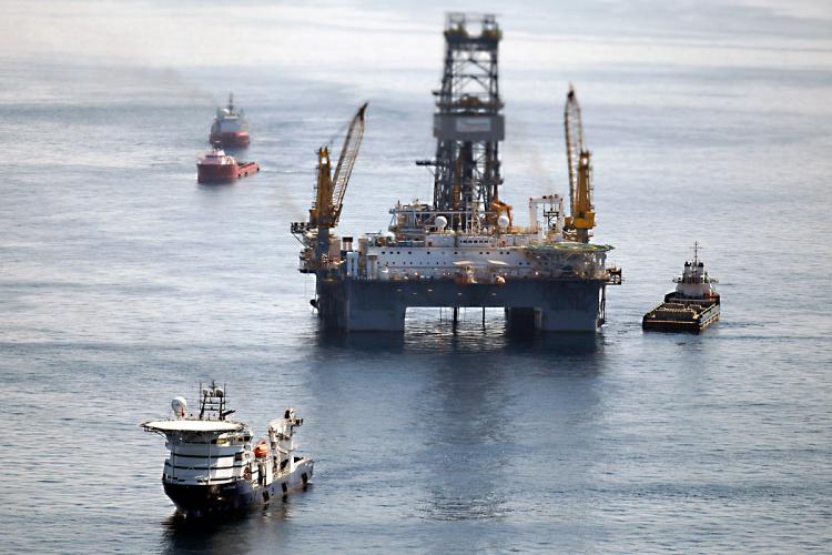 LOOKING FOR OIL: Ships work near the site of the BP Deepwater Horizon oil spill on Aug. 3, 2010 off the coast of Louisiana. BP will reportedly resume deepwater drilling in the Gulf of Mexico, after striking a deal with federal regulators. (Chris Graythen/Getty Images)
